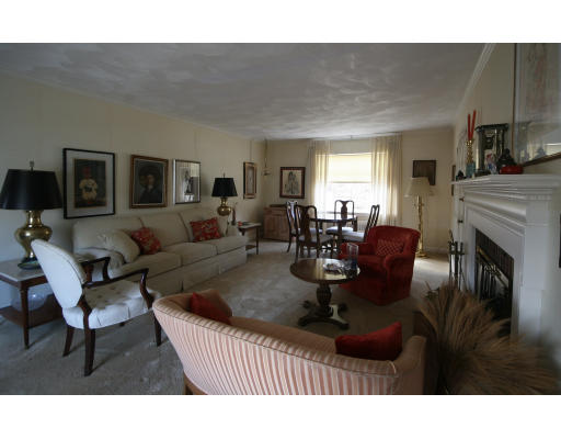 21 Whitney Road Newton, MA 02460 - Photo 3 of 14 a living room with furniture a flat screen tv and a fireplace