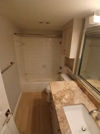 a bathroom with a tub and a sink