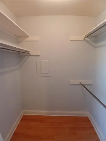 a view of an empty walk in closet