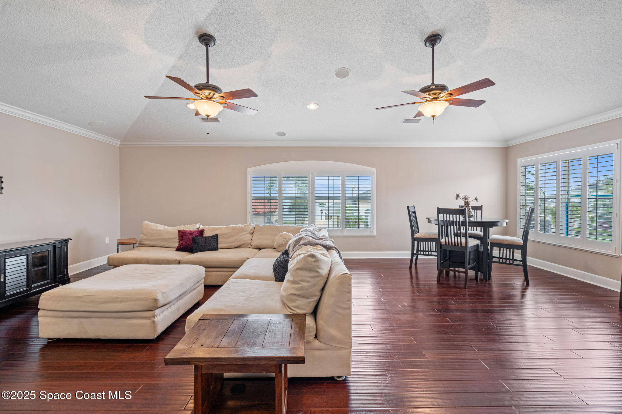 1835 Harbor Point Drive Merritt Island, FL 32952 - Photo 19 of 67 a living room with furniture a dining table a lamp and a large window
