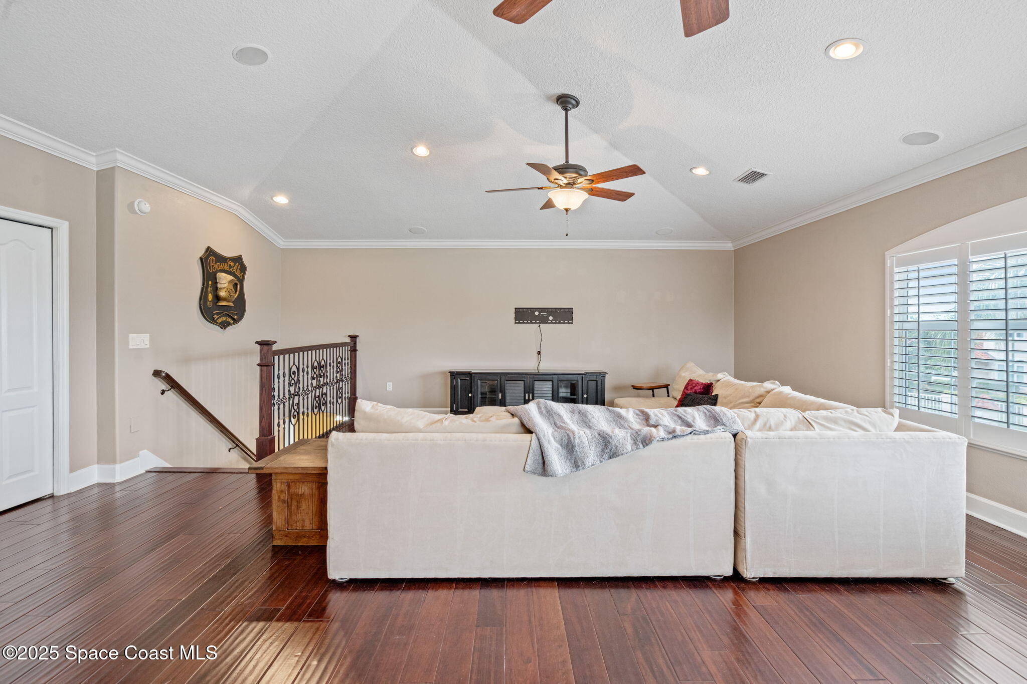 1835 Harbor Point Drive Merritt Island, FL 32952 - Photo 20 of 67 a living room with a couch and wooden floor