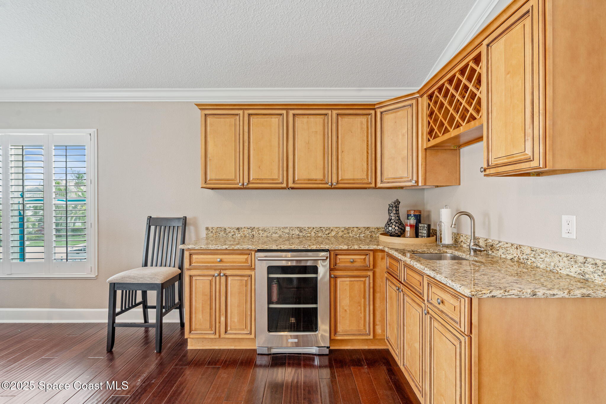 1835 Harbor Point Drive Merritt Island, FL 32952 - Photo 21 of 67 a kitchen with stainless steel appliances granite countertop a stove and a wooden cabinets