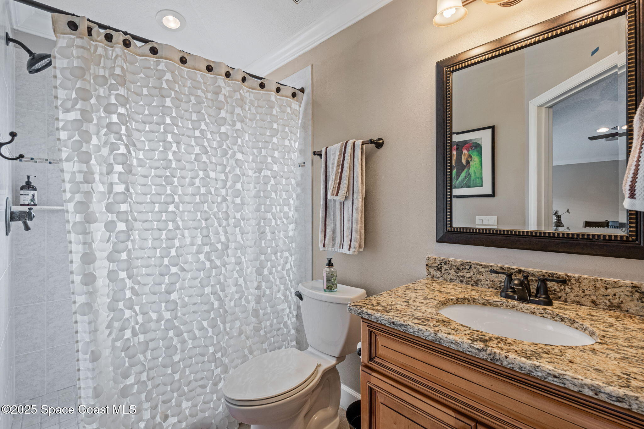 1835 Harbor Point Drive Merritt Island, FL 32952 - Photo 24 of 67 a bathroom with a granite countertop sink toilet and shower
