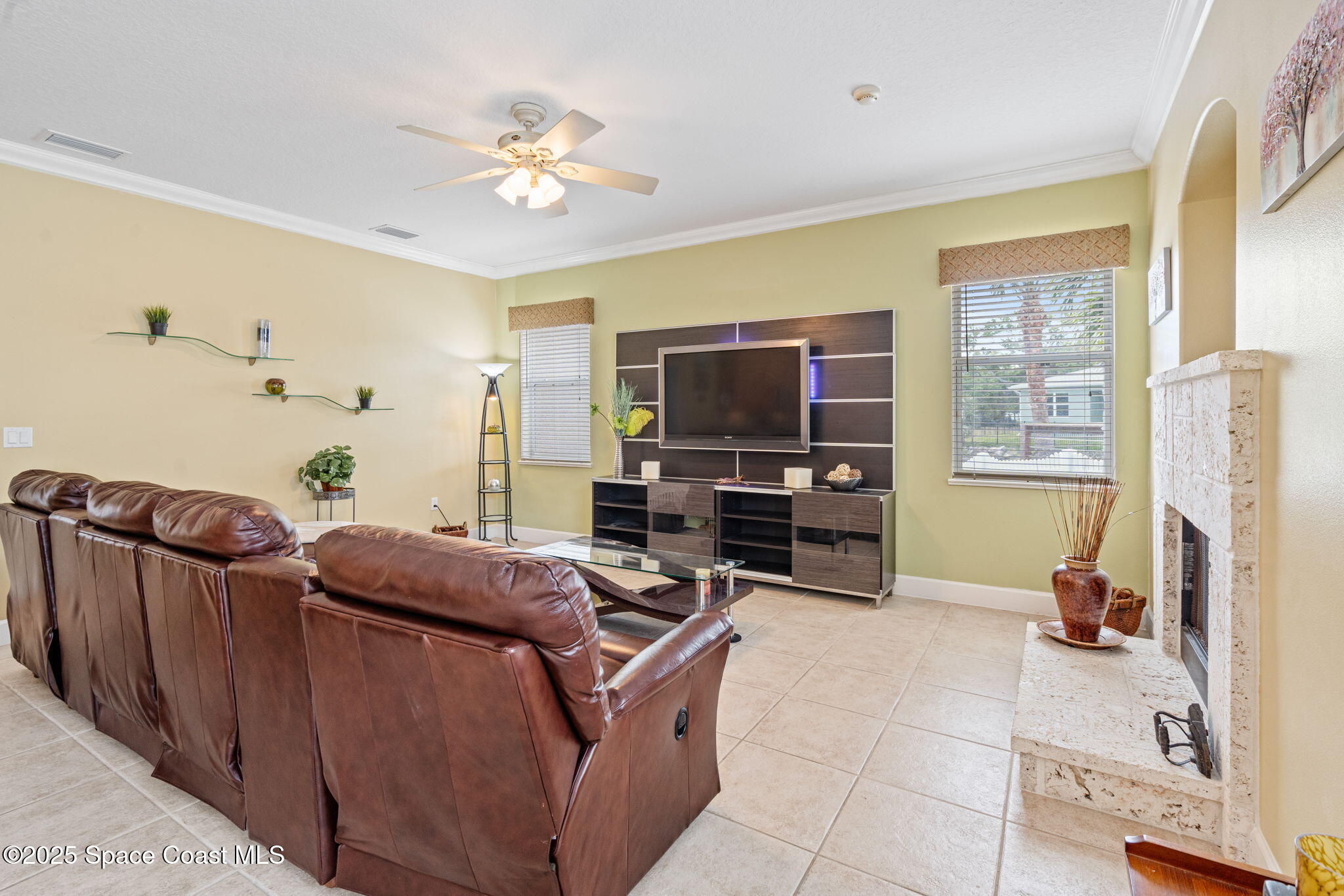 1835 Harbor Point Drive Merritt Island, FL 32952 - Photo 32 of 67 a living room with furniture and a flat screen tv