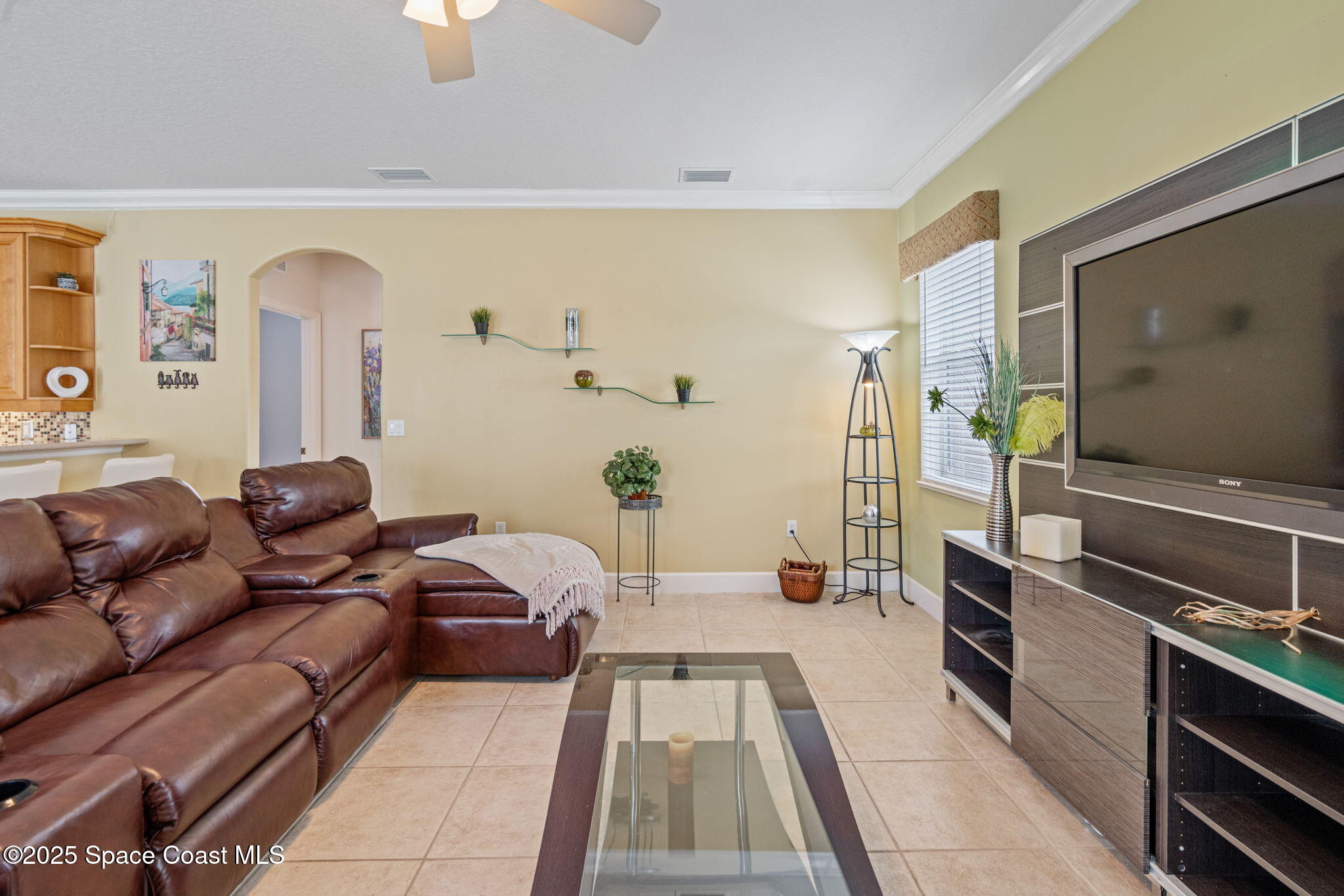 1835 Harbor Point Drive Merritt Island, FL 32952 - Photo 33 of 67 a living room with furniture and a flat screen tv