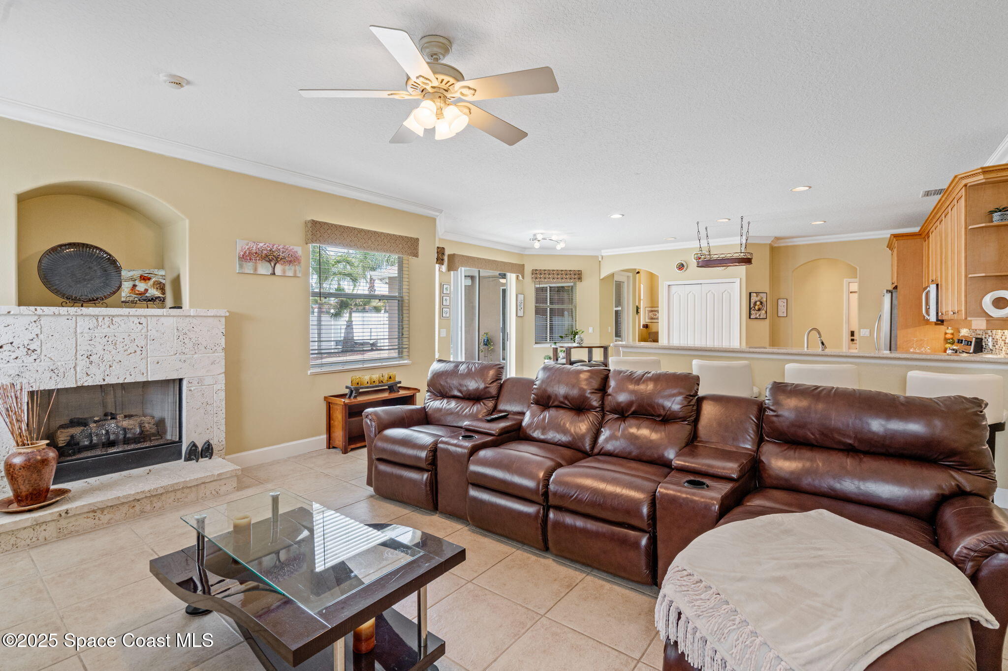 1835 Harbor Point Drive Merritt Island, FL 32952 - Photo 35 of 67 a living room with furniture and a fireplace