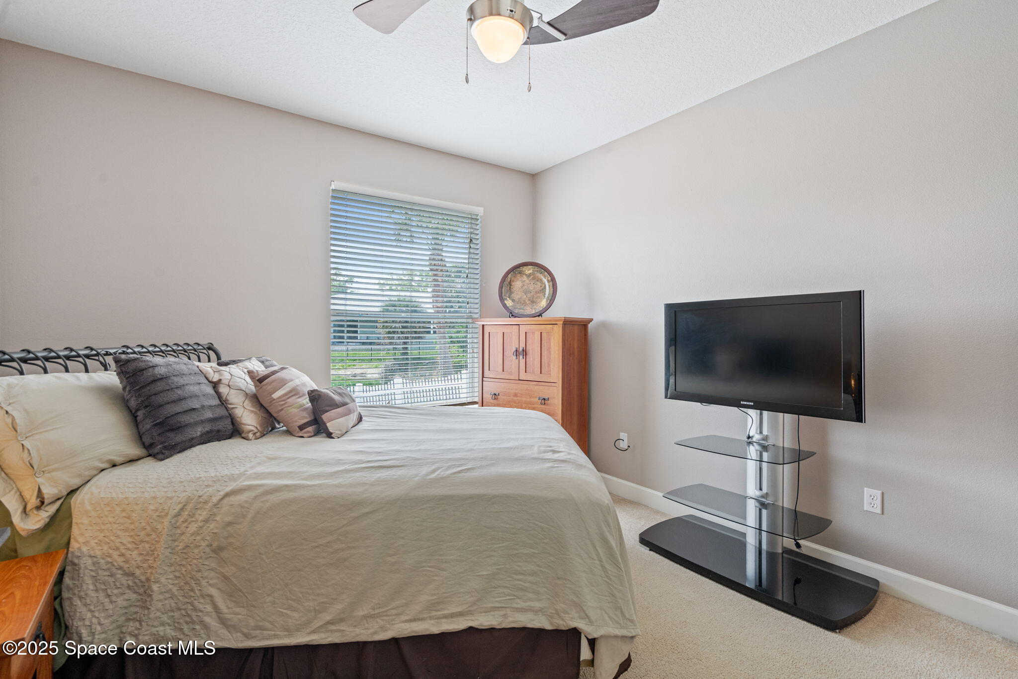 1835 Harbor Point Drive Merritt Island, FL 32952 - Photo 46 of 67 a bedroom with a bed and a flat screen tv