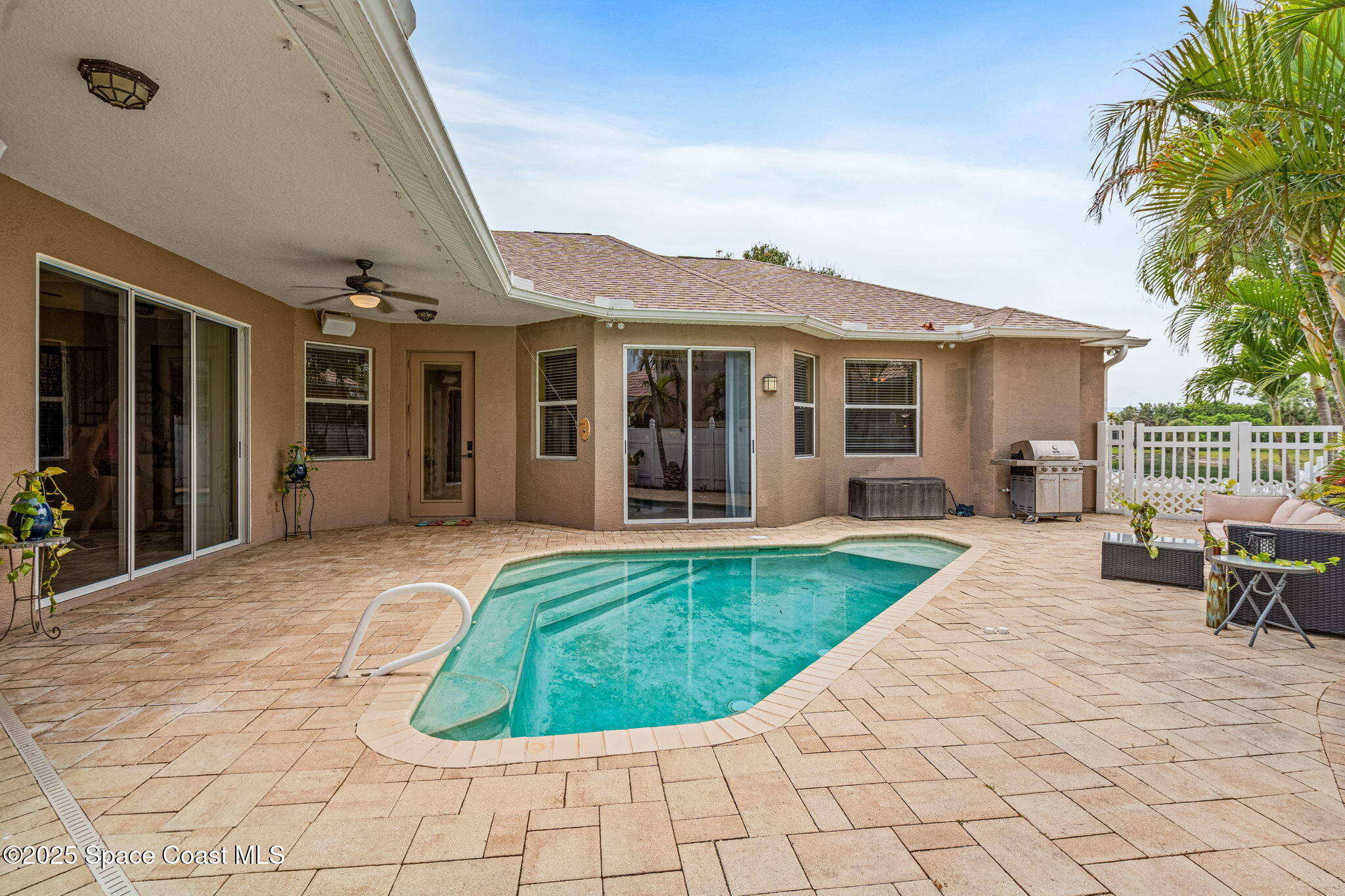 1835 Harbor Point Drive Merritt Island, FL 32952 - Photo 48 of 67 a view of a house with backyard porch and sitting area
