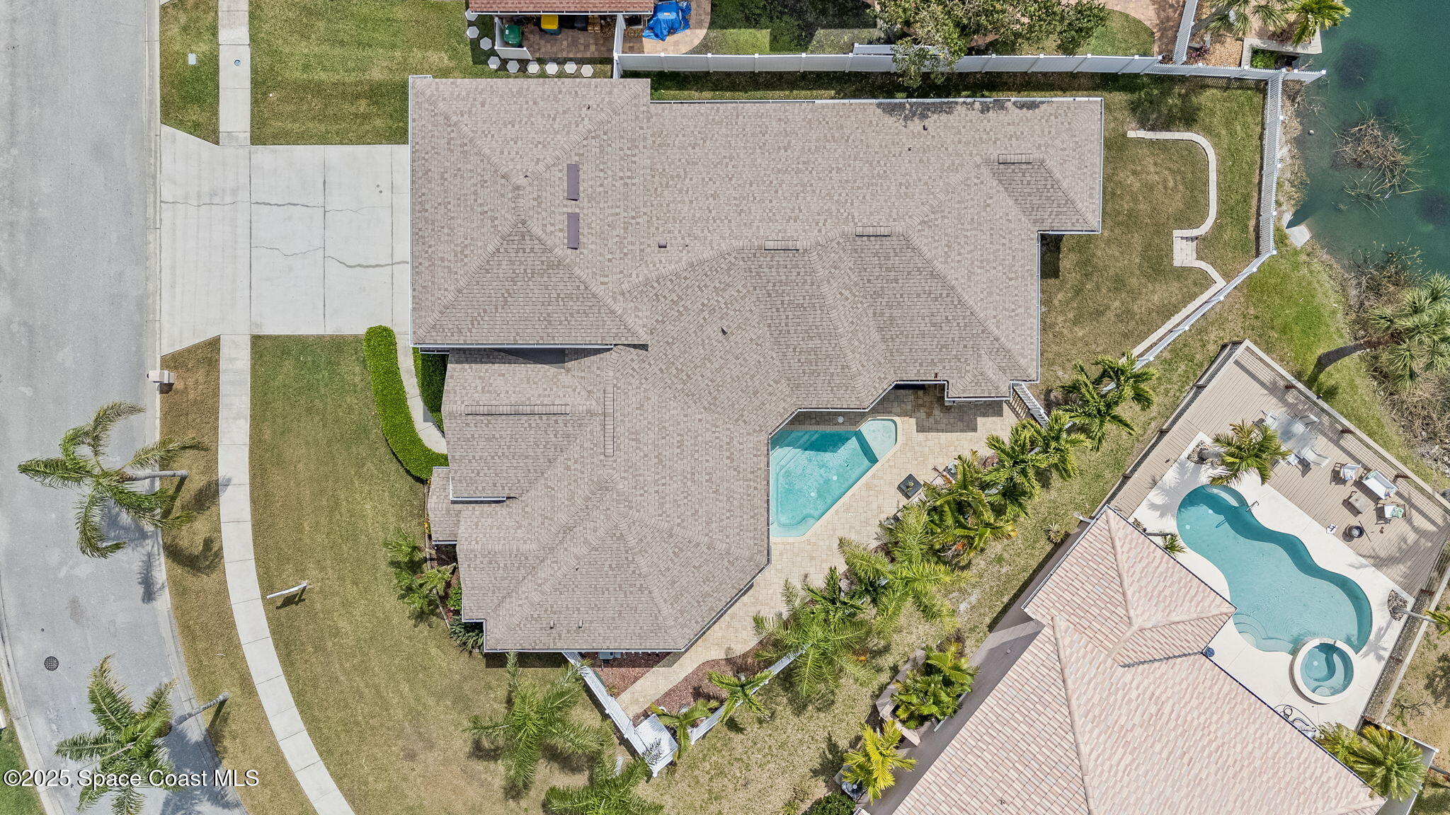 1835 Harbor Point Drive Merritt Island, FL 32952 - Photo 59 of 67 an aerial view of a house with a yard