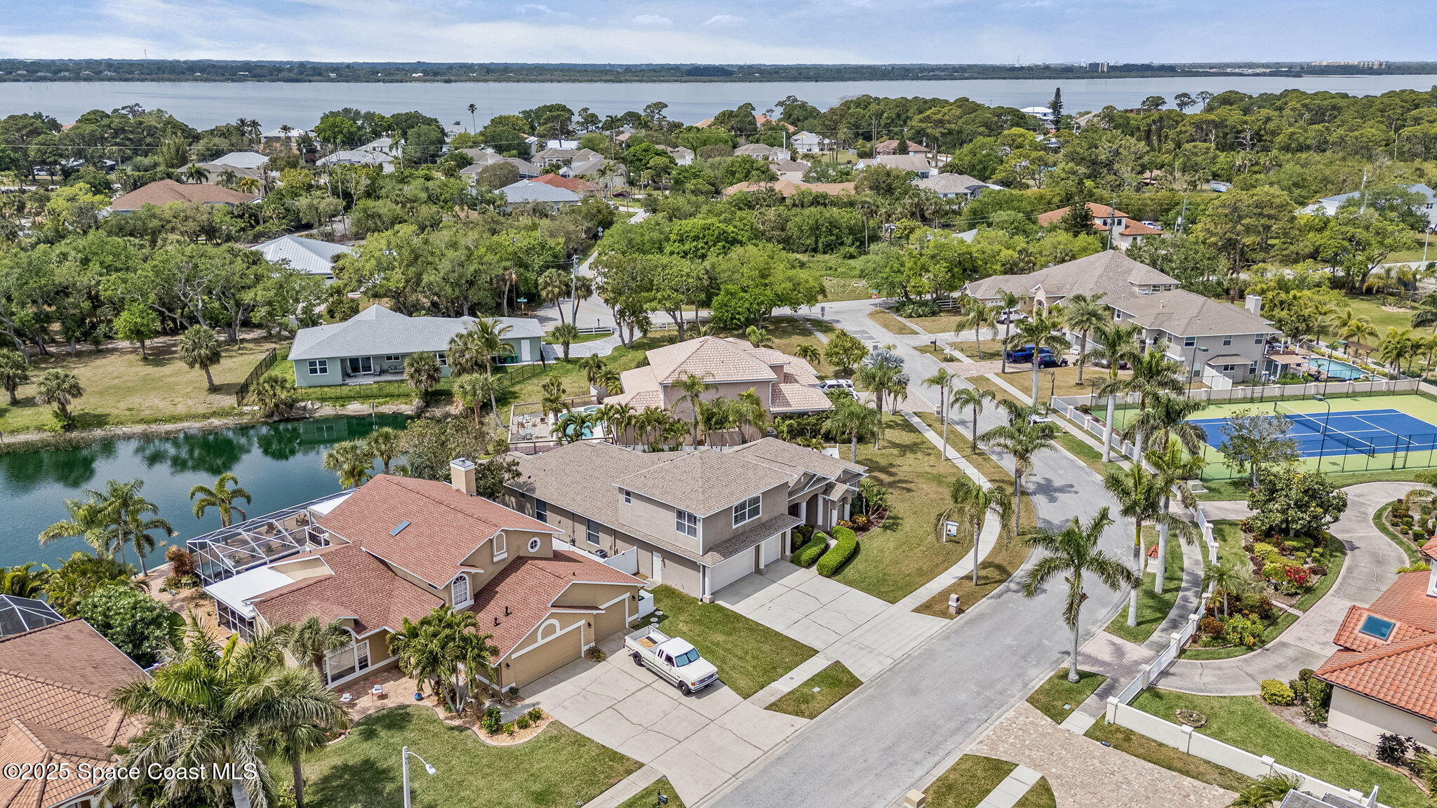 1835 Harbor Point Drive Merritt Island, FL 32952 - Photo 60 of 67 an aerial view of a house with a yard