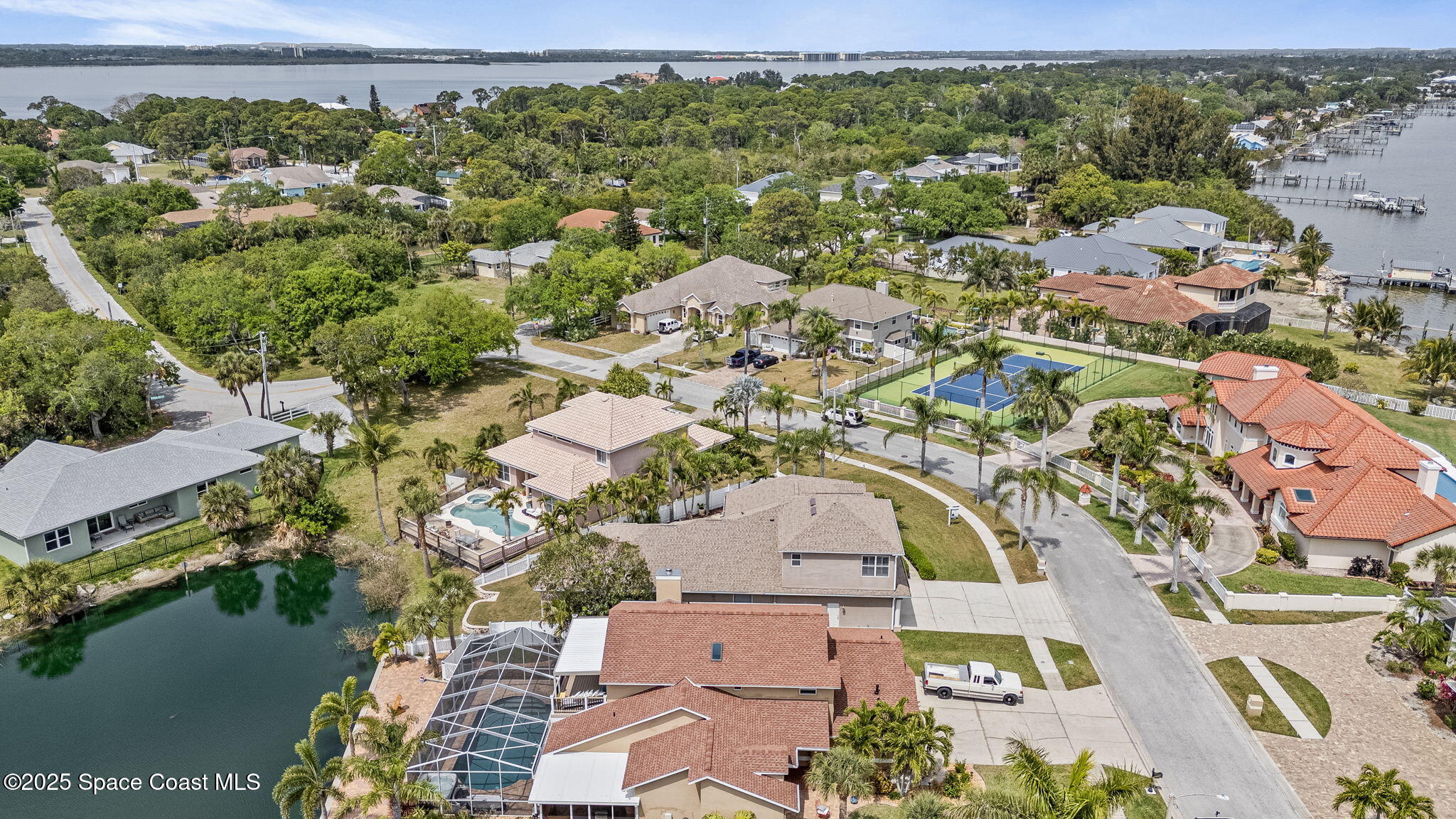 1835 Harbor Point Drive Merritt Island, FL 32952 - Photo 61 of 67 an aerial view of a house with a lake view