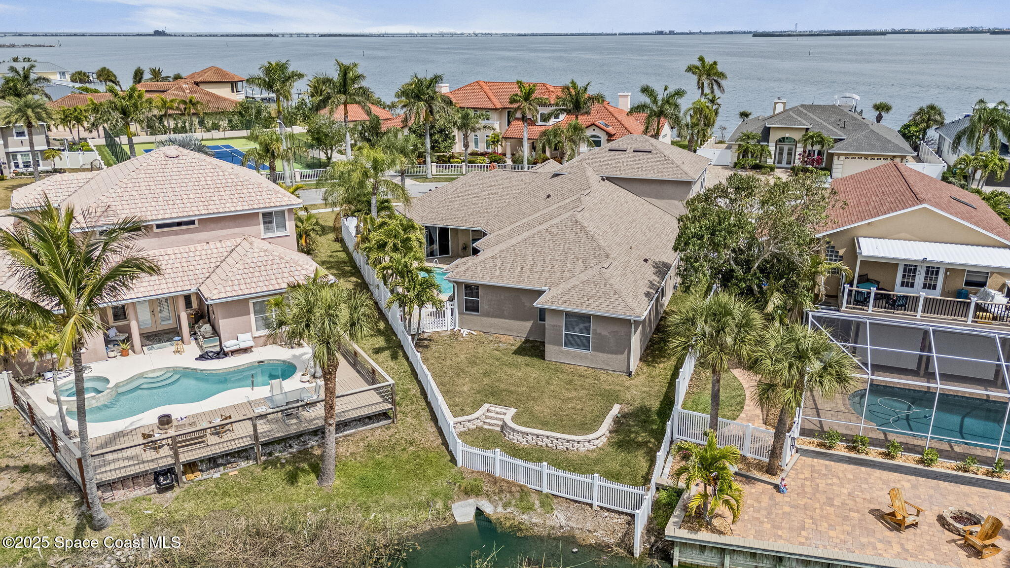 1835 Harbor Point Drive Merritt Island, FL 32952 - Photo 66 of 67 an aerial view of a house with a yard and seating space