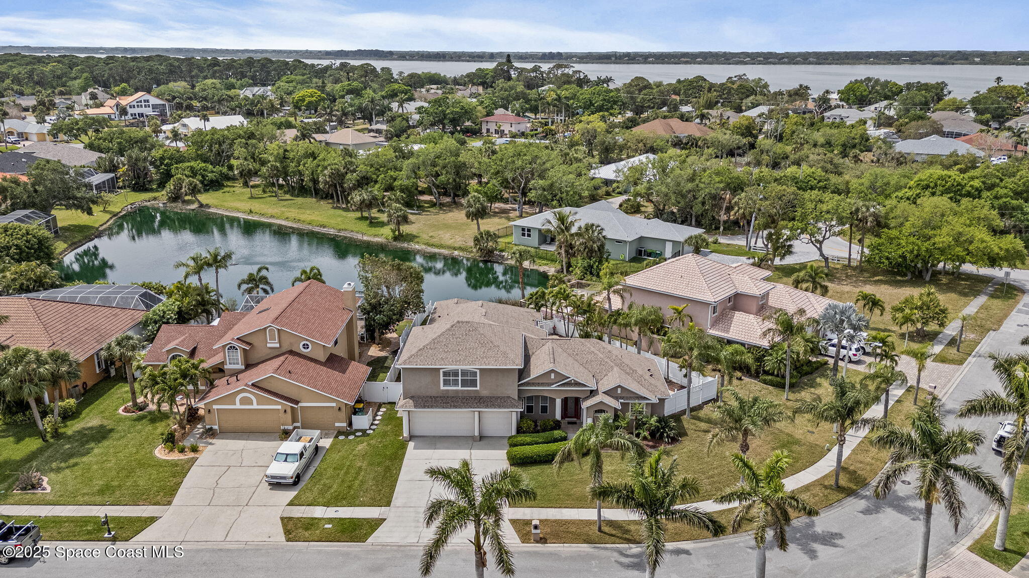 1835 Harbor Point Drive Merritt Island, FL 32952 - Photo 67 of 67 an aerial view of residential houses with outdoor space and trees