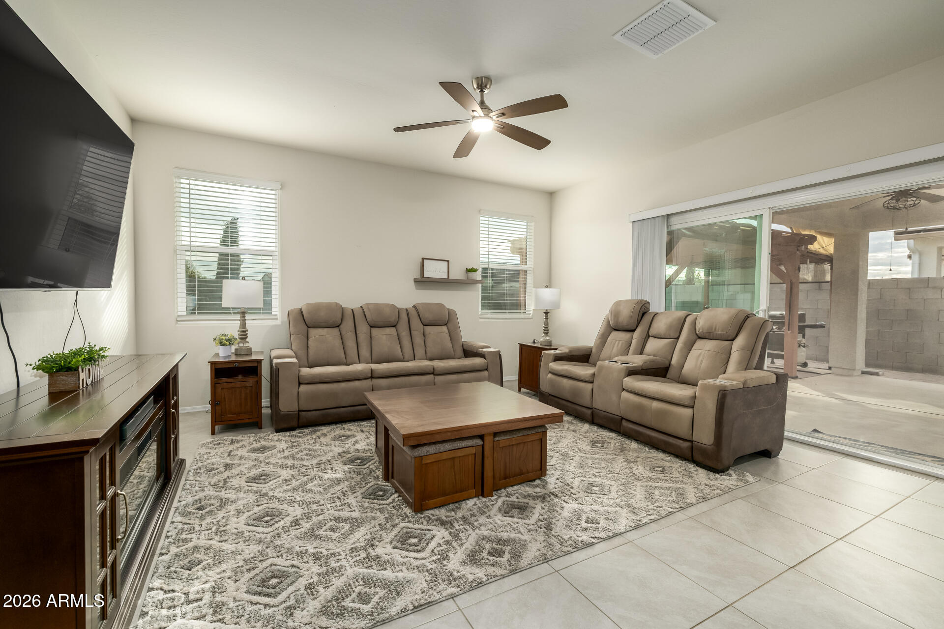 9471 Greenhouse Road Florence, AZ 85132 - Photo 8 of 22 a living room with furniture and a flat screen tv