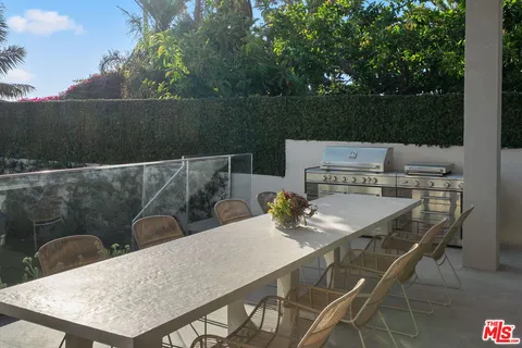 a terrace of a house with outdoor seating