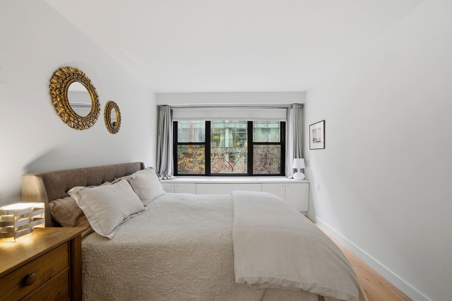 1065 Park Avenue, Unit 3C Manhattan, NY 10128 - Photo 6 of 8 a bedroom with a bed and a large window