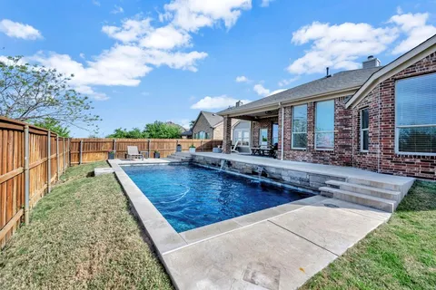 a view of a house with swimming pool