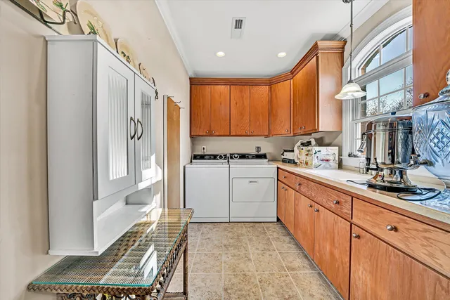 a spacious bathroom with a tub a double vanity sink and a mirror