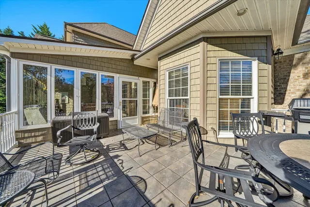 a spacious bathroom with a tub sink and mirror