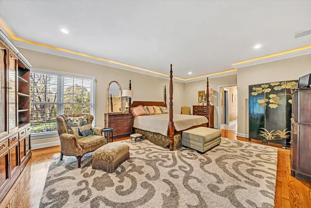a bathroom with a double vanity sink toilet mirror and bathtub