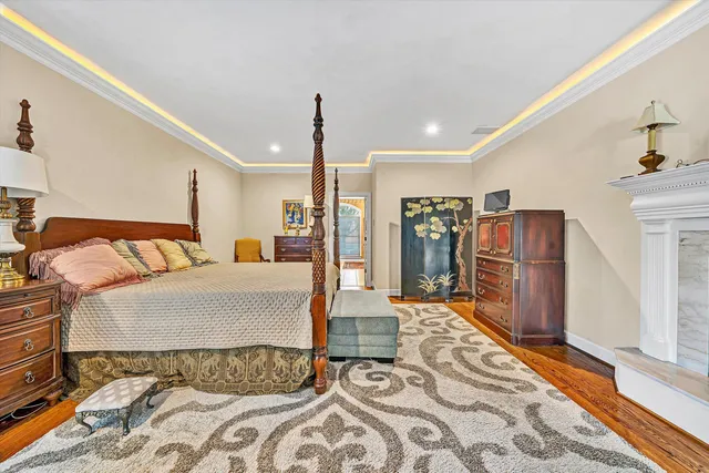 a bed room with large bed and furniture