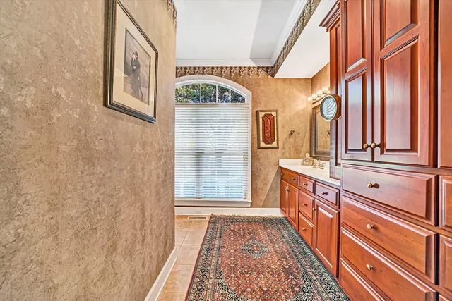 a bedroom with bed and a window