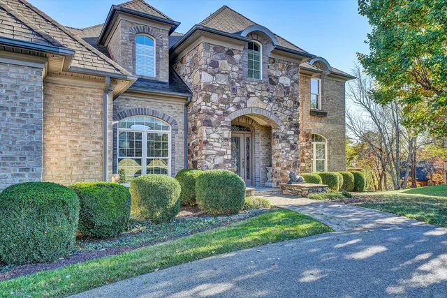 a view of a livingroom with furniture furniture entryway and wooden floor