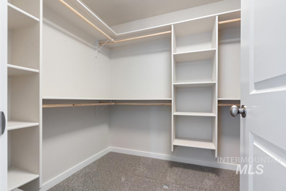 1355 Crescent Street Weiser, ID 83672 - Photo 23 of 31 Walk in closet with carpet flooring