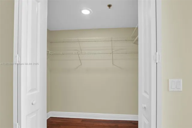 a view of hallway with furniture and a window