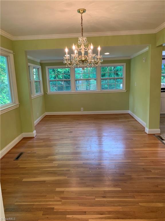 3028 Kinnamon Road Winston-Salem, NC 27104 - Photo 5 of 25 Shot from living room into dining room with den behind it.