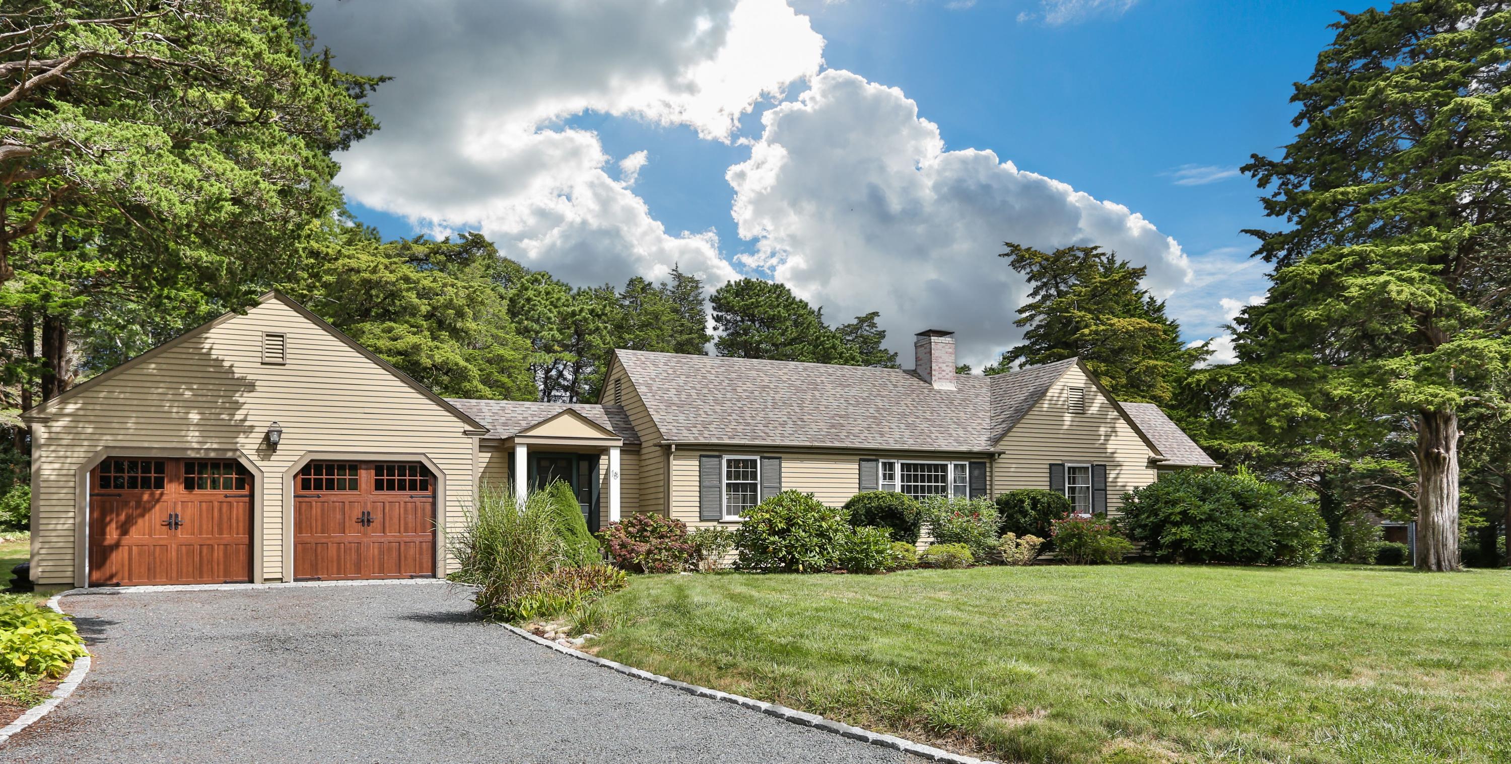 18 Sparrowhawk Road Orleans, MA 02653 - Photo 2 of 43 a front view of a house with a garden