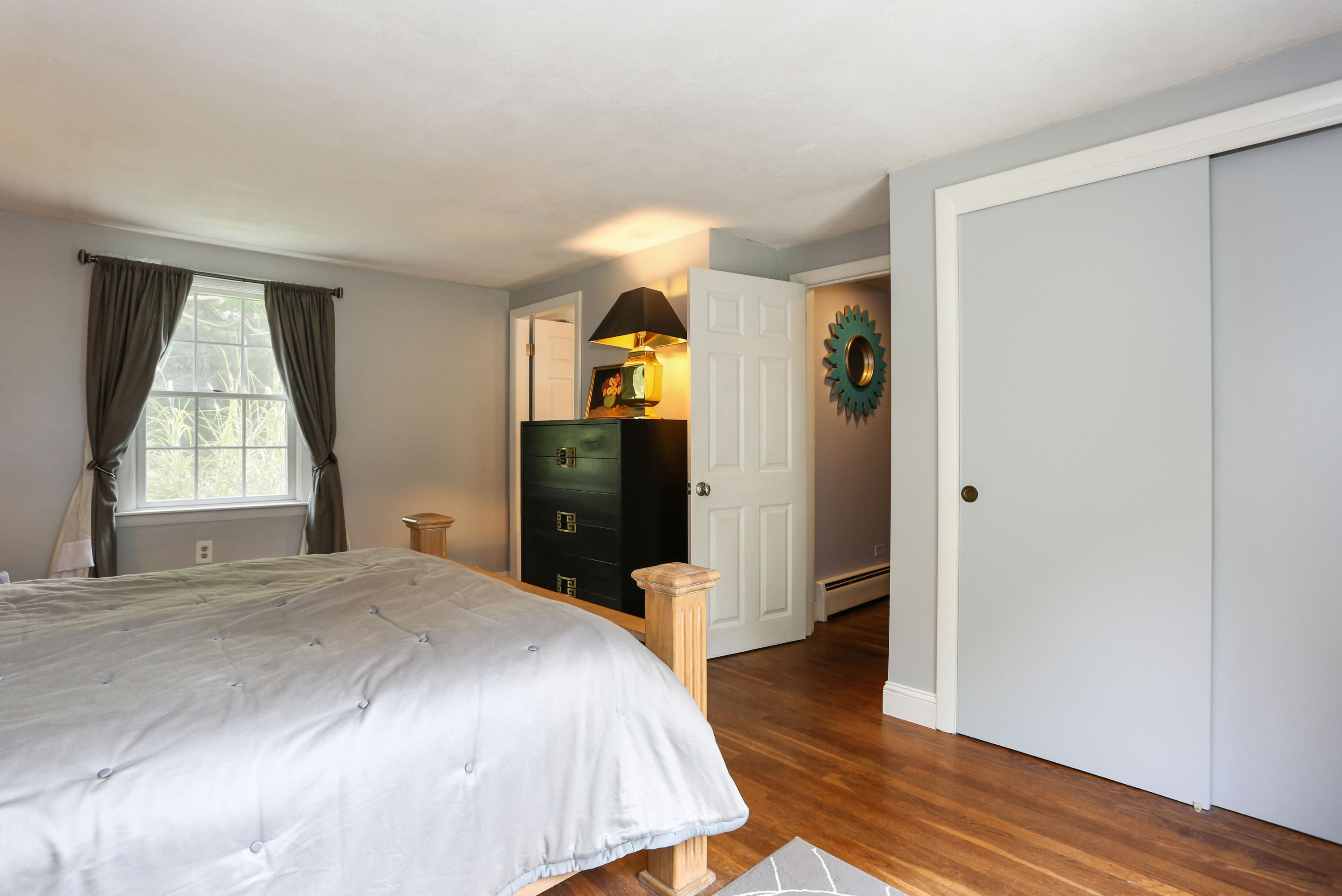 18 Sparrowhawk Road Orleans, MA 02653 - Photo 24 of 43 a bedroom with a bed and wooden floor