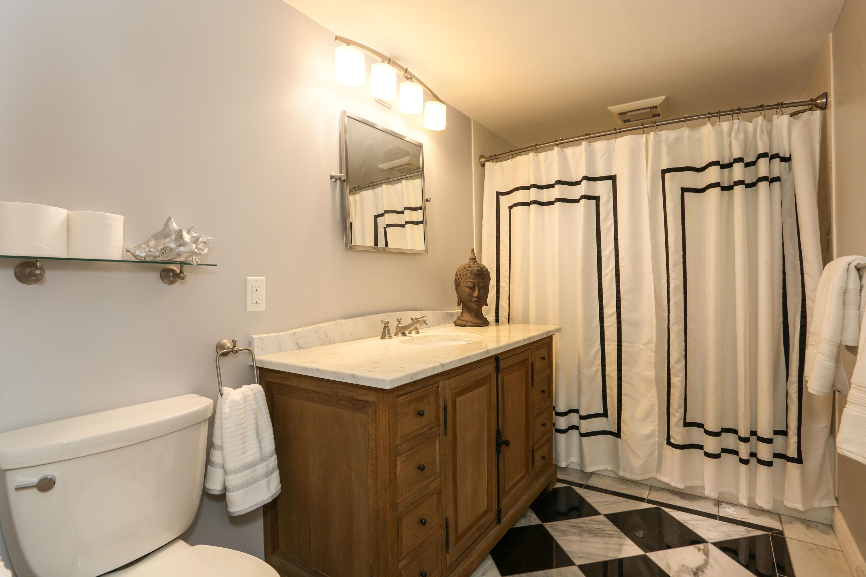 18 Sparrowhawk Road Orleans, MA 02653 - Photo 25 of 43 a bathroom with a granite countertop sink toilet and shower