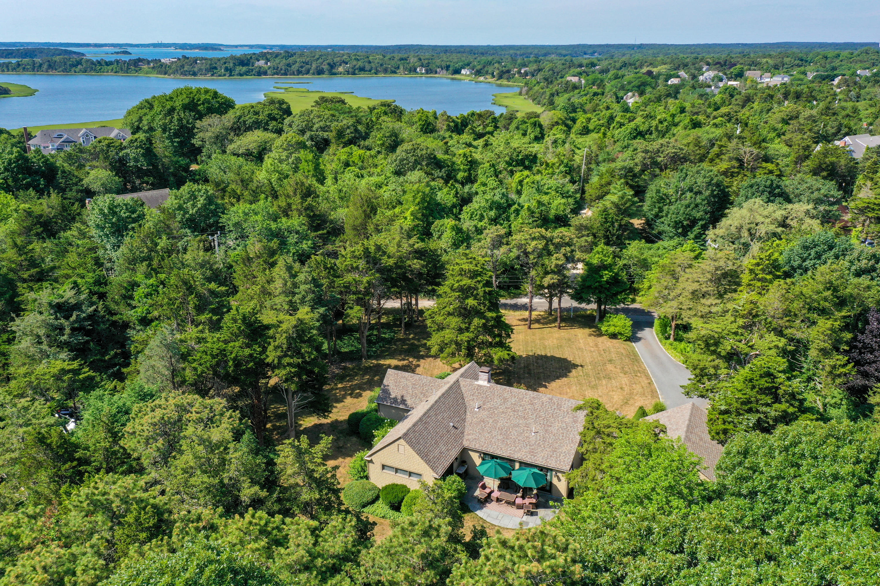 18 Sparrowhawk Road Orleans, MA 02653 - Photo 30 of 43 an aerial view of a house with a yard and lake view