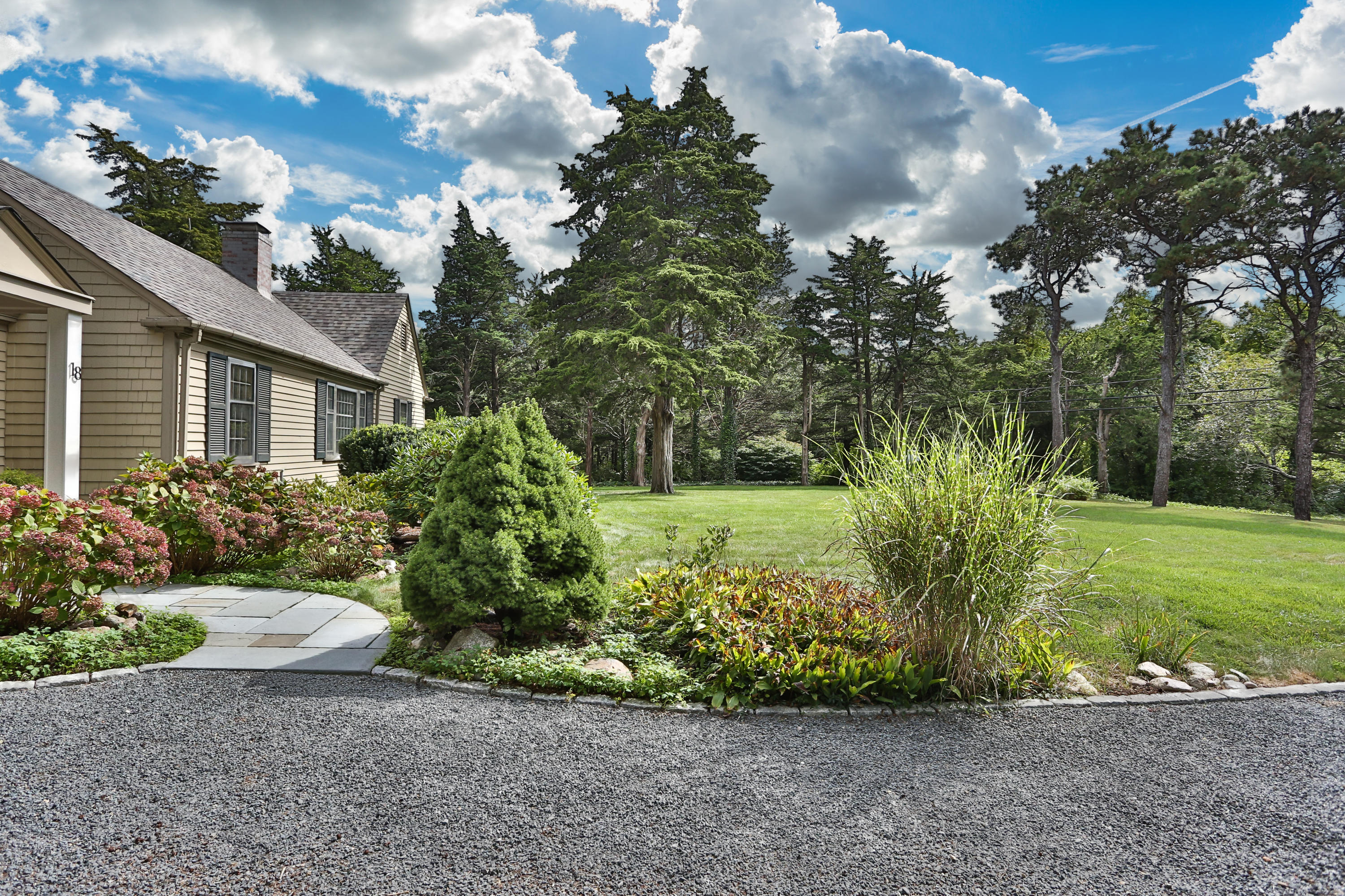 18 Sparrowhawk Road Orleans, MA 02653 - Photo 3 of 43 a front view of a house with a yard