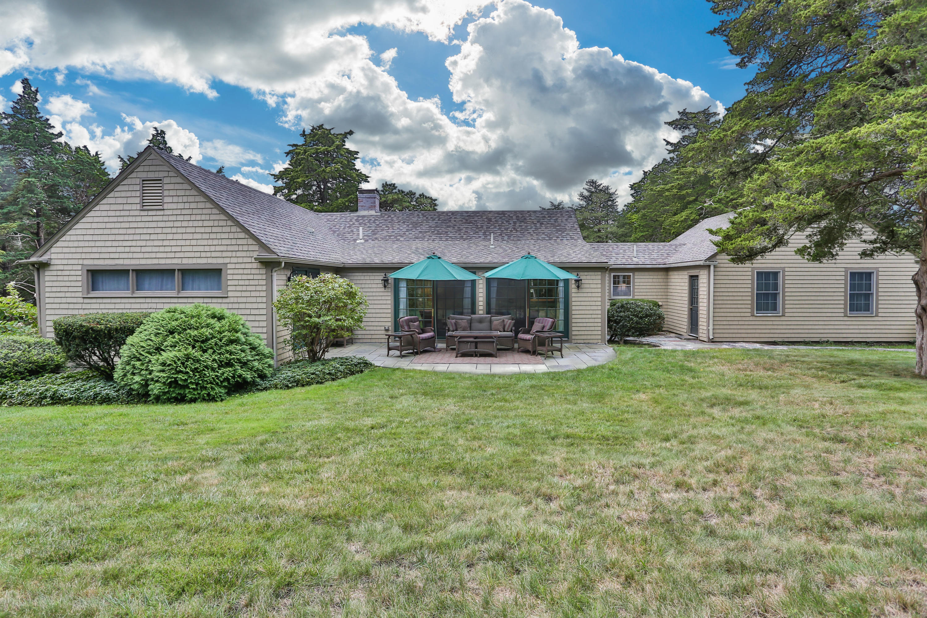 18 Sparrowhawk Road Orleans, MA 02653 - Photo 32 of 43 a front view of a house with yard patio and green space