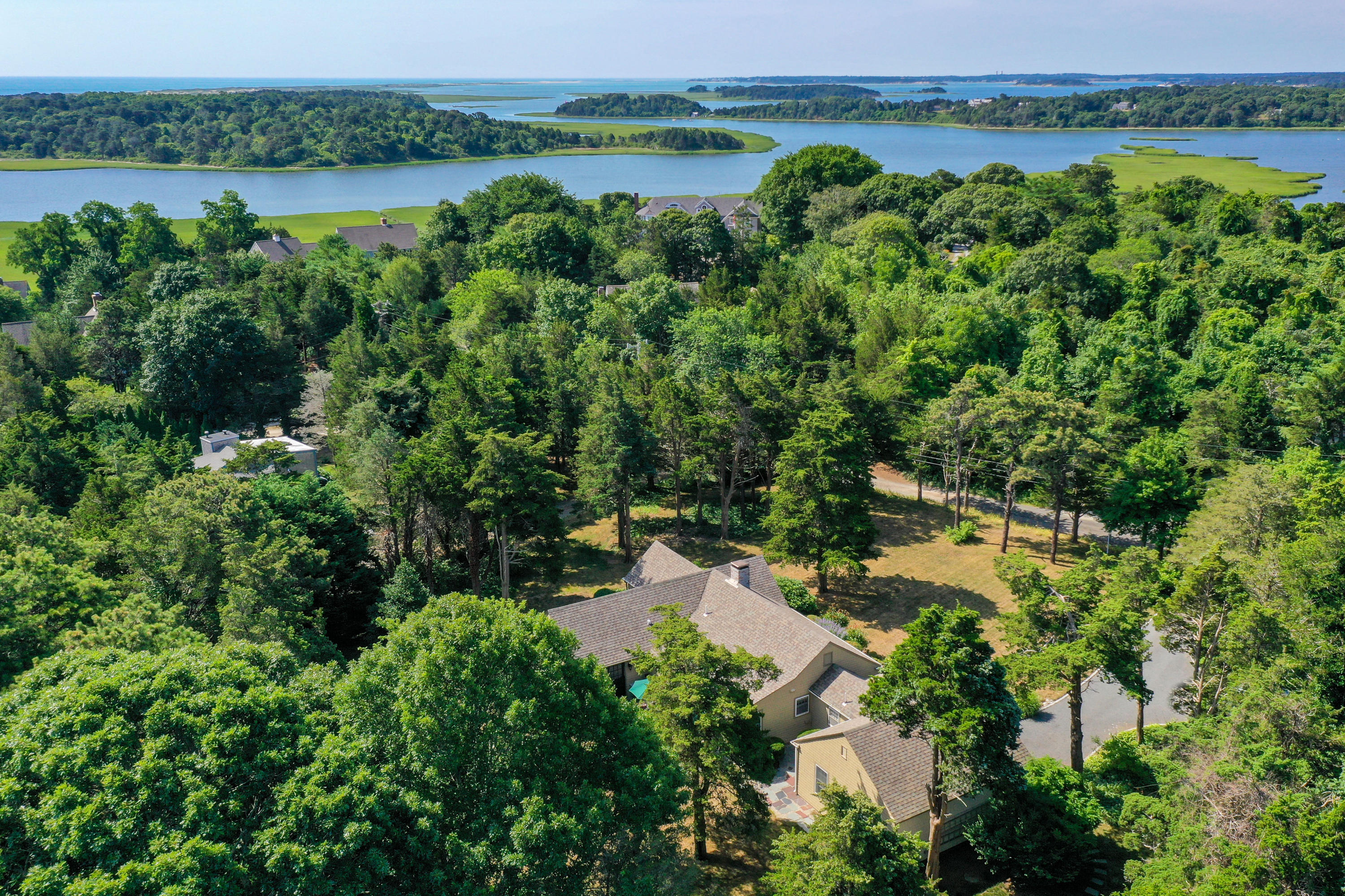 18 Sparrowhawk Road Orleans, MA 02653 - Photo 37 of 43 an aerial view of a houses with a yard and lake view