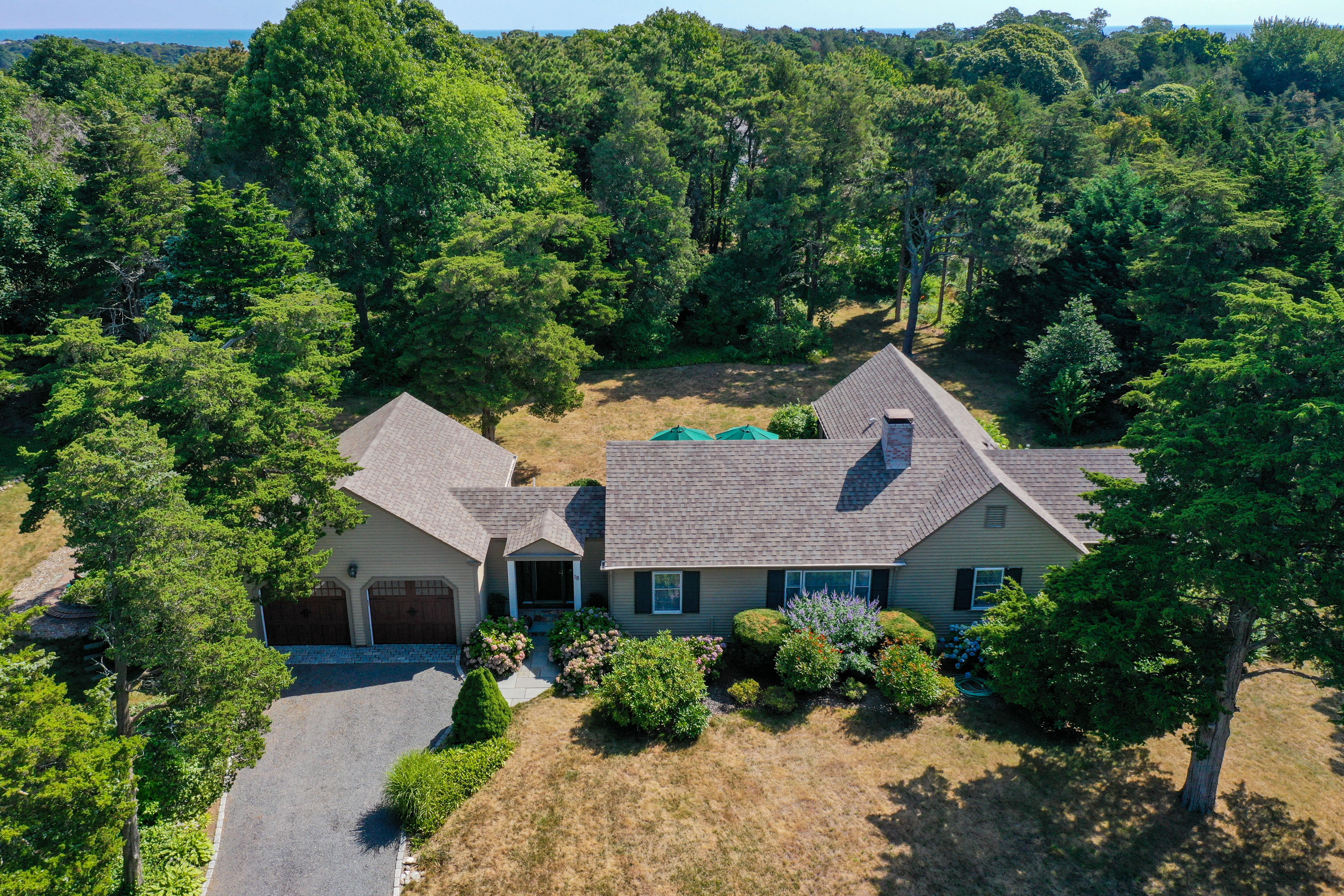 18 Sparrowhawk Road Orleans, MA 02653 - Photo 4 of 43 an aerial view of a house with yard and green space