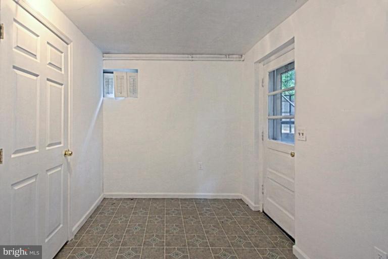 821 Snider Lane Silver Spring, MD 20905 - Photo 18 of 26 Lower Level Den w outside entrance