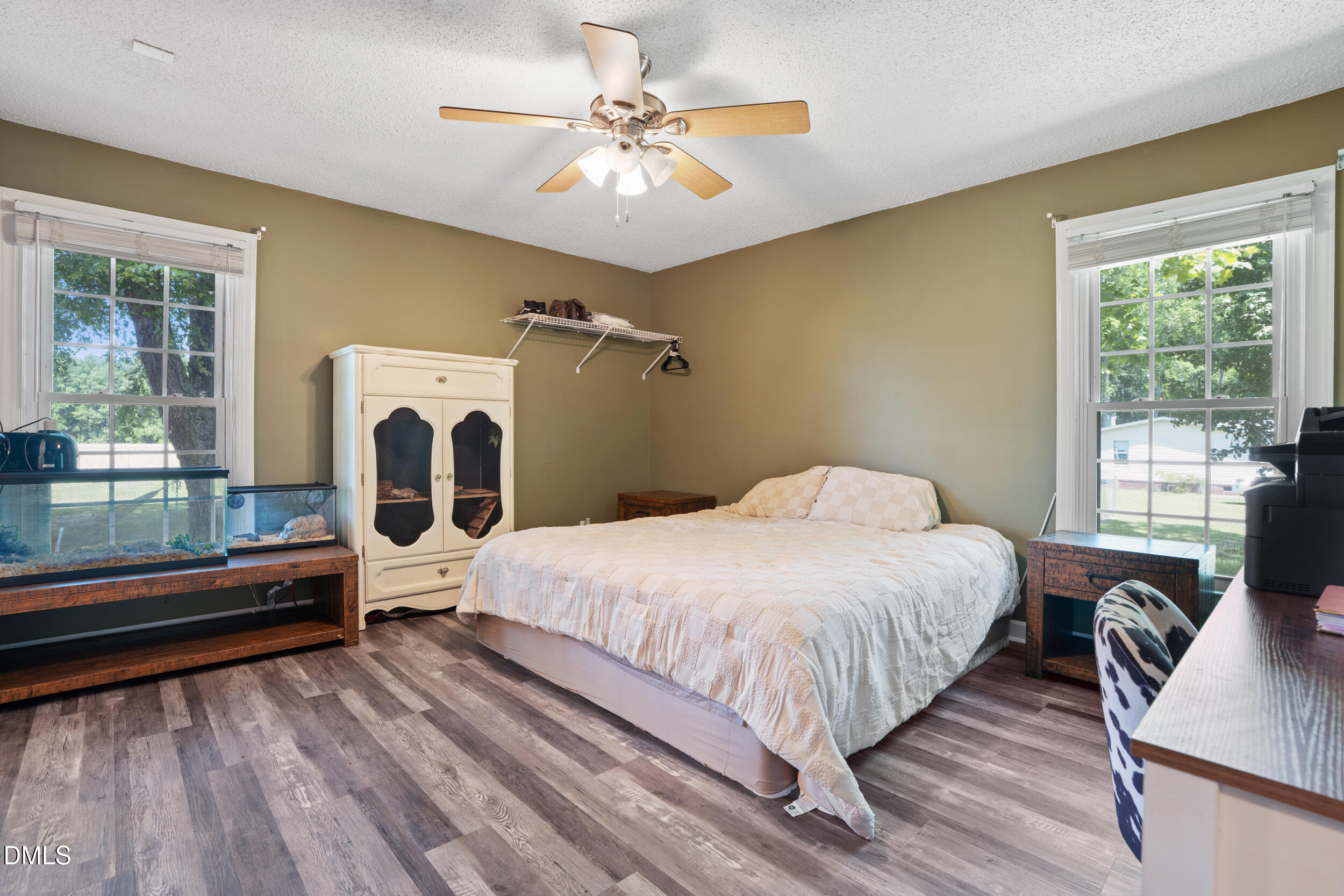 311 Bridgers Road Kenly, NC 27542 - Photo 22 of 46 a bedroom with a bed and wooden floor