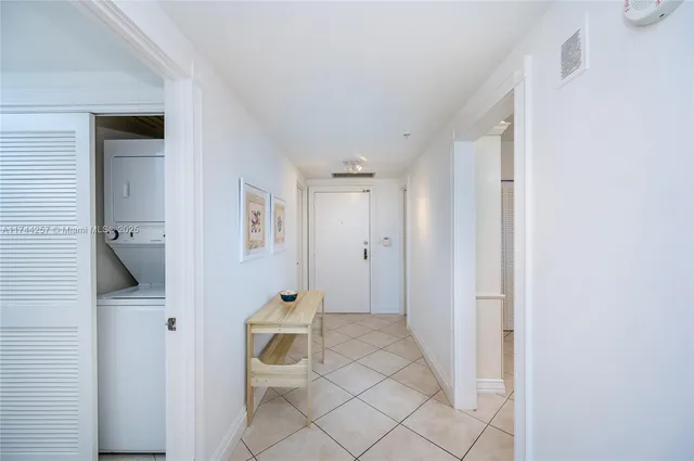 a bathroom with a toilet and a view of bathroom