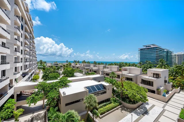 a view of balcony with seating space and plants