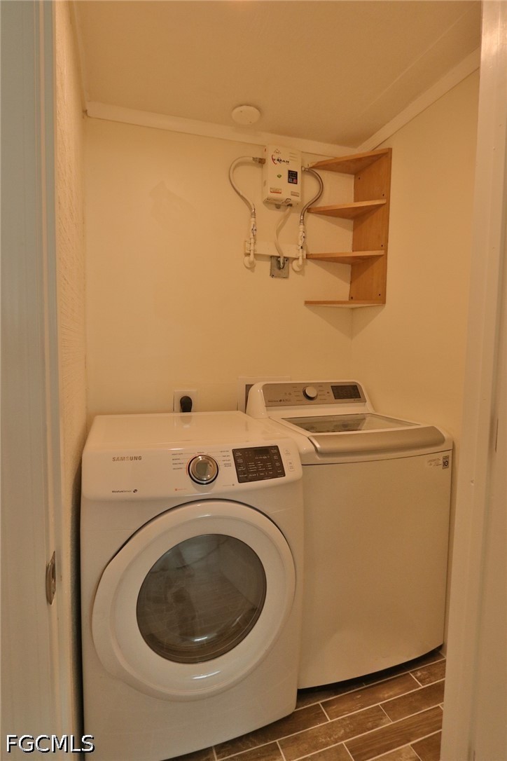 11 California Road Lehigh Acres, FL 33936 - Photo 13 of 19 a utility room with dryer and washer