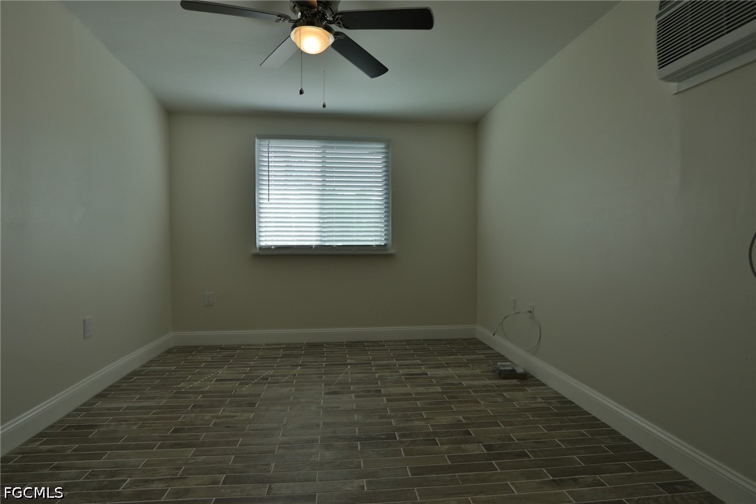 11 California Road Lehigh Acres, FL 33936 - Photo 8 of 19 an empty room with a window
