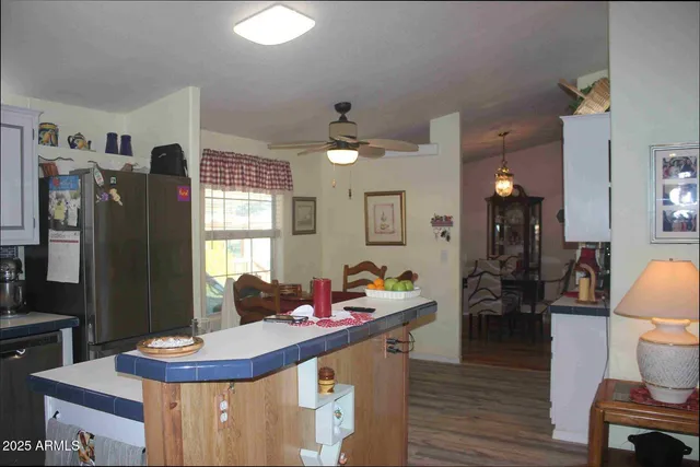 a living room with furniture window and a flat screen tv