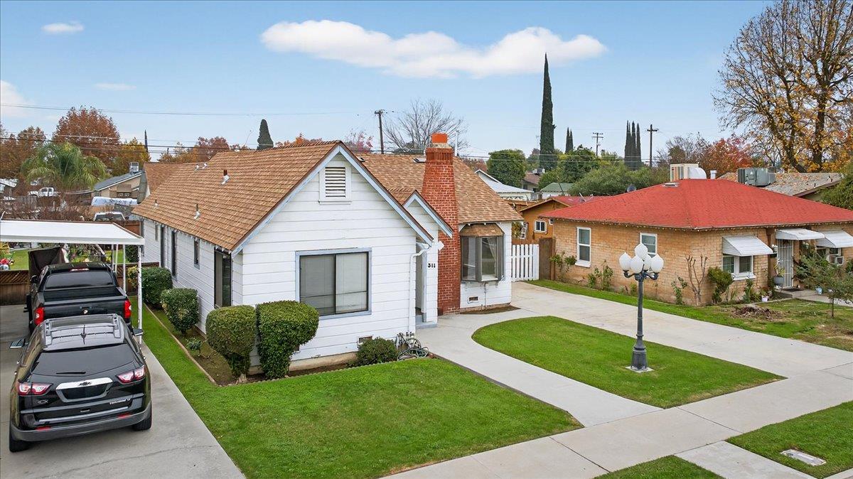 311 South K Street Madera, CA 93637 - Photo 31 of 46 a house view with a garden space