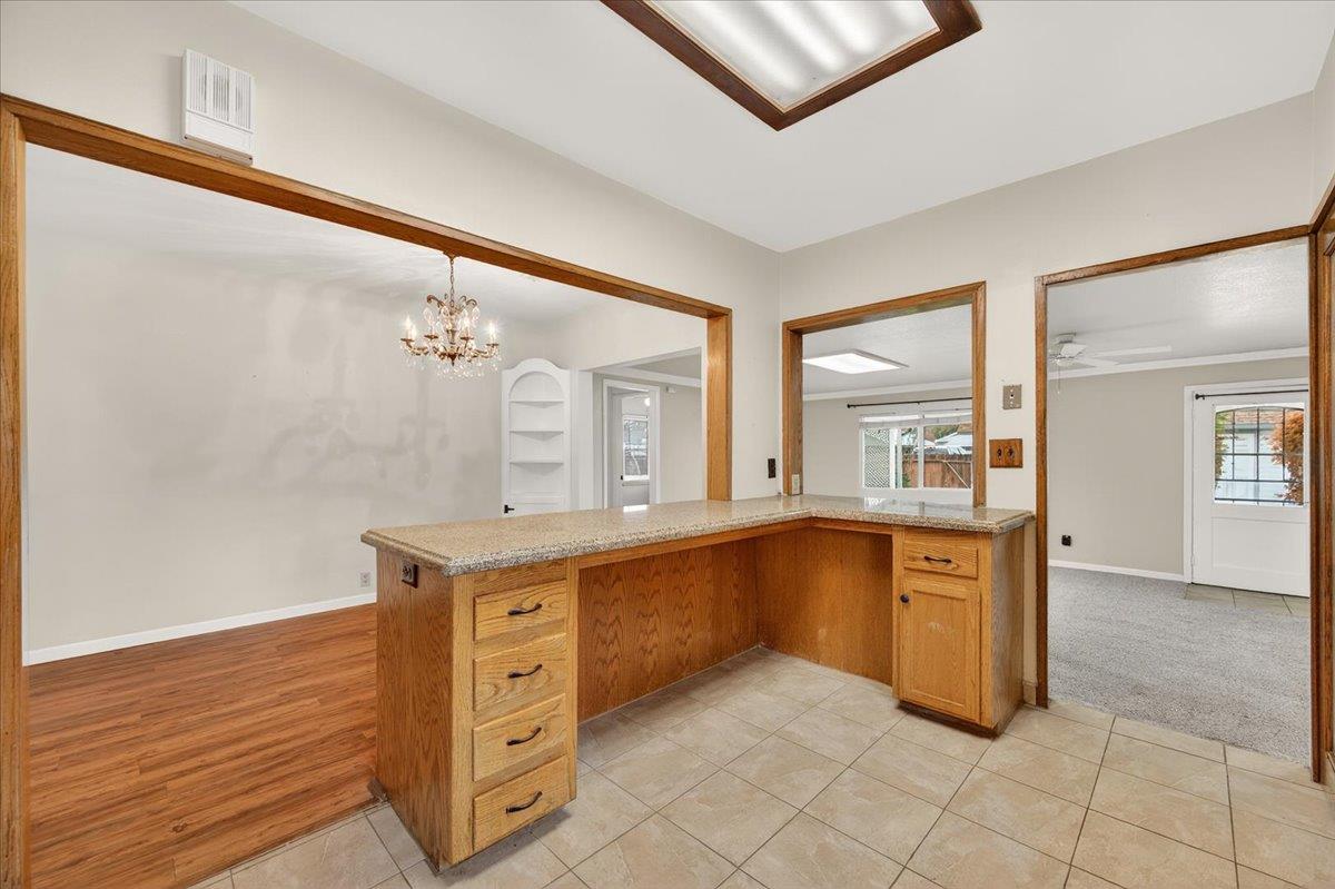 311 South K Street Madera, CA 93637 - Photo 40 of 46 a spacious bathroom with a granite countertop sink a mirror and a bathtub