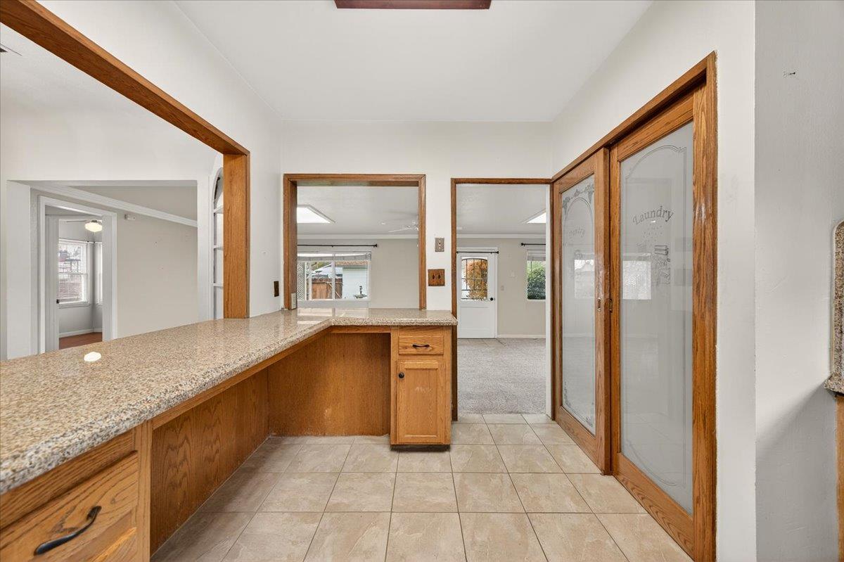 311 South K Street Madera, CA 93637 - Photo 41 of 46 a large en suite bathroom with a granite countertop sink and a large mirror