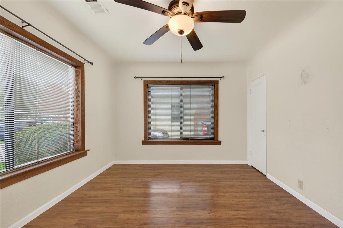 311 South K Street Madera, CA 93637 - Photo 43 of 46 a view of a room with a ceiling fan and wooden floor