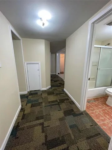 a view of a house with a yard and garage